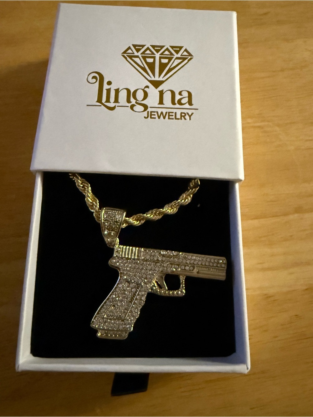 Lingna Gold Tone Gun Pendant Necklace with Sparkling Stones